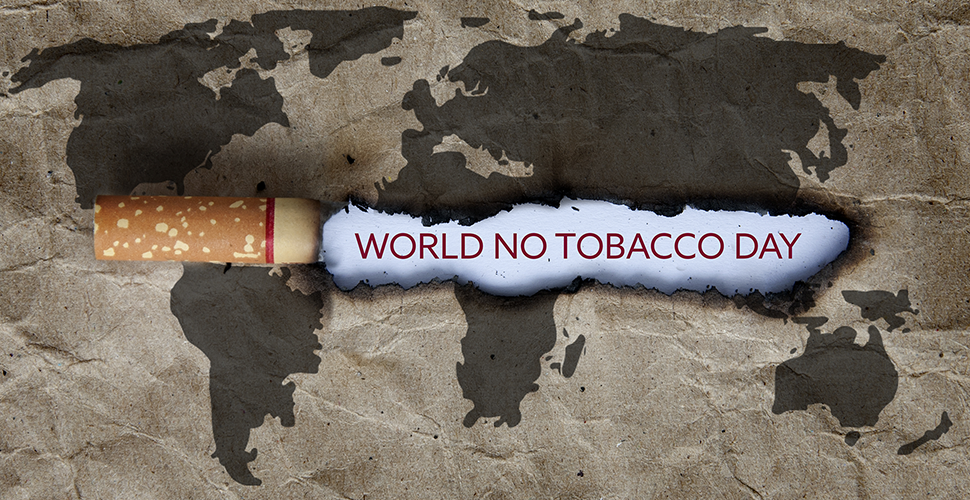 World No Tobacco Day map with cigarette burn going through the middle