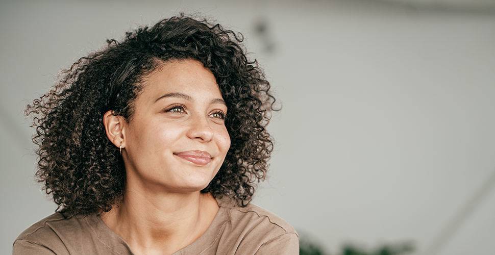 remote worker pondering the relationship between employee wellbeing and tobacco use