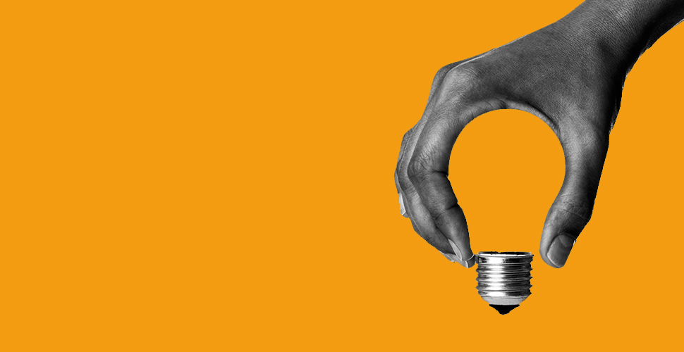 Light bulb in human hand