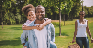 young family experiencing one of the many benefits of tobacco cessation