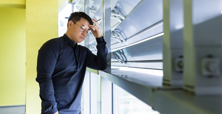 businessman stress smoking by the window