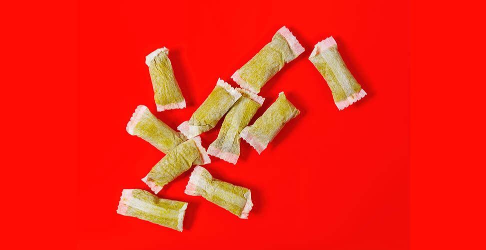 Pouches containing nicotine on a red background